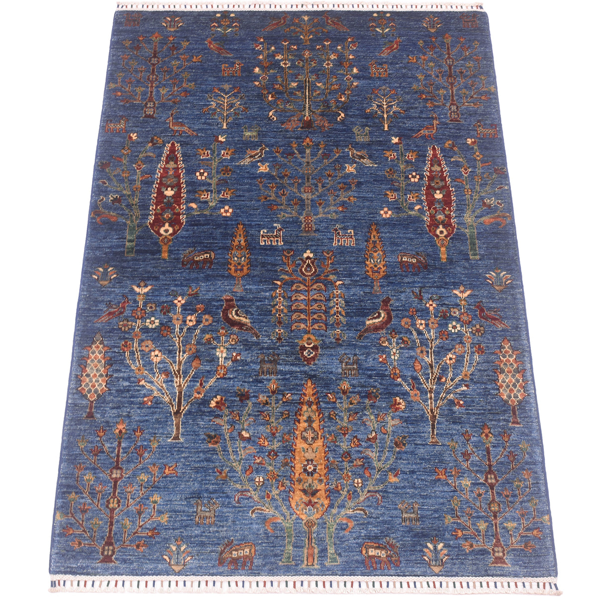 A 6x4 rectangular pictorial blue Loribaft rug with an intricate traditional tribal pattern featuring stylised trees, birds, and geometric motifs in rust, beige, and brown, finished with a fringed edge.
