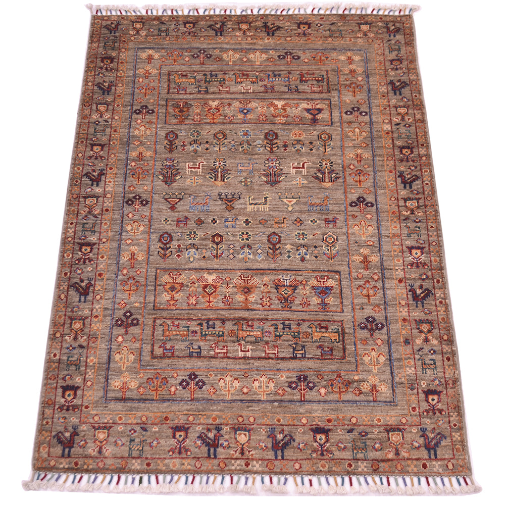 A rectangular hand-knotted fine Afghan Samarkand wool rug with a traditional geometric and floral pattern, featuring cream fringe on the top and bottom edges. The colour palette is dominated by warm grey-brown and detail tones in blue, ochre, rust and cream.