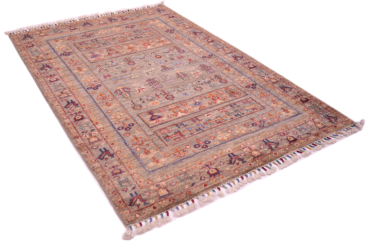 An oriental-style fine Afghan Samarkand rug with an intricate multi-coloured pattern, featuring a grey-brown squirrel field colour, and cream fringe on the ends, shown from an elevated angle on a white background.