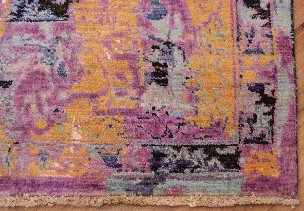 Border corner design from contemporary Seismic carpet showing elements of a traditional format but abstracted and modern colours. Wool pile and art viscose silk.