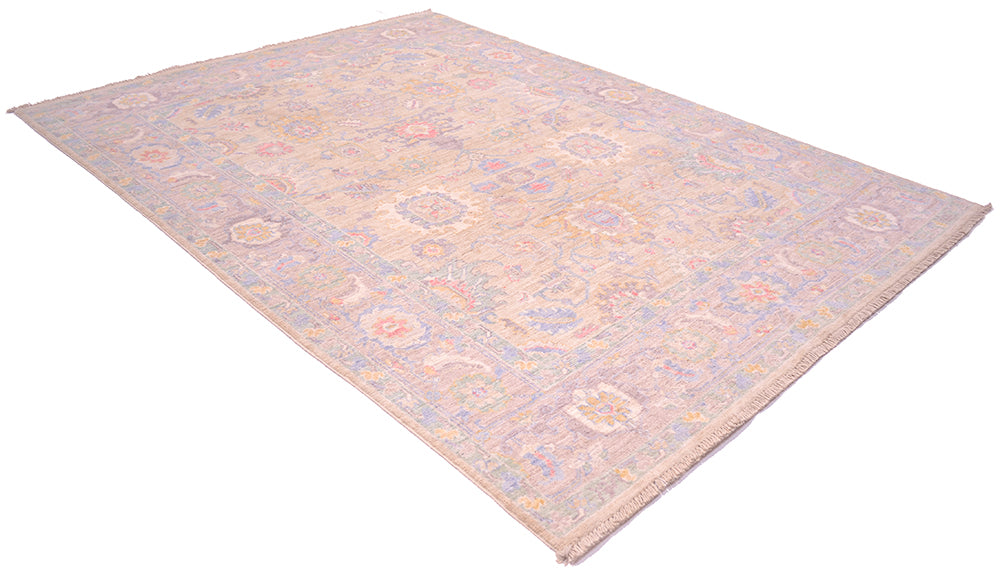 Angled view of Afghan Rug with Serapi traditional design in soft pastel colours woven on a cotton foundation. Hints of blue, pink and golden tones with pale gold field colour and cloudband border.