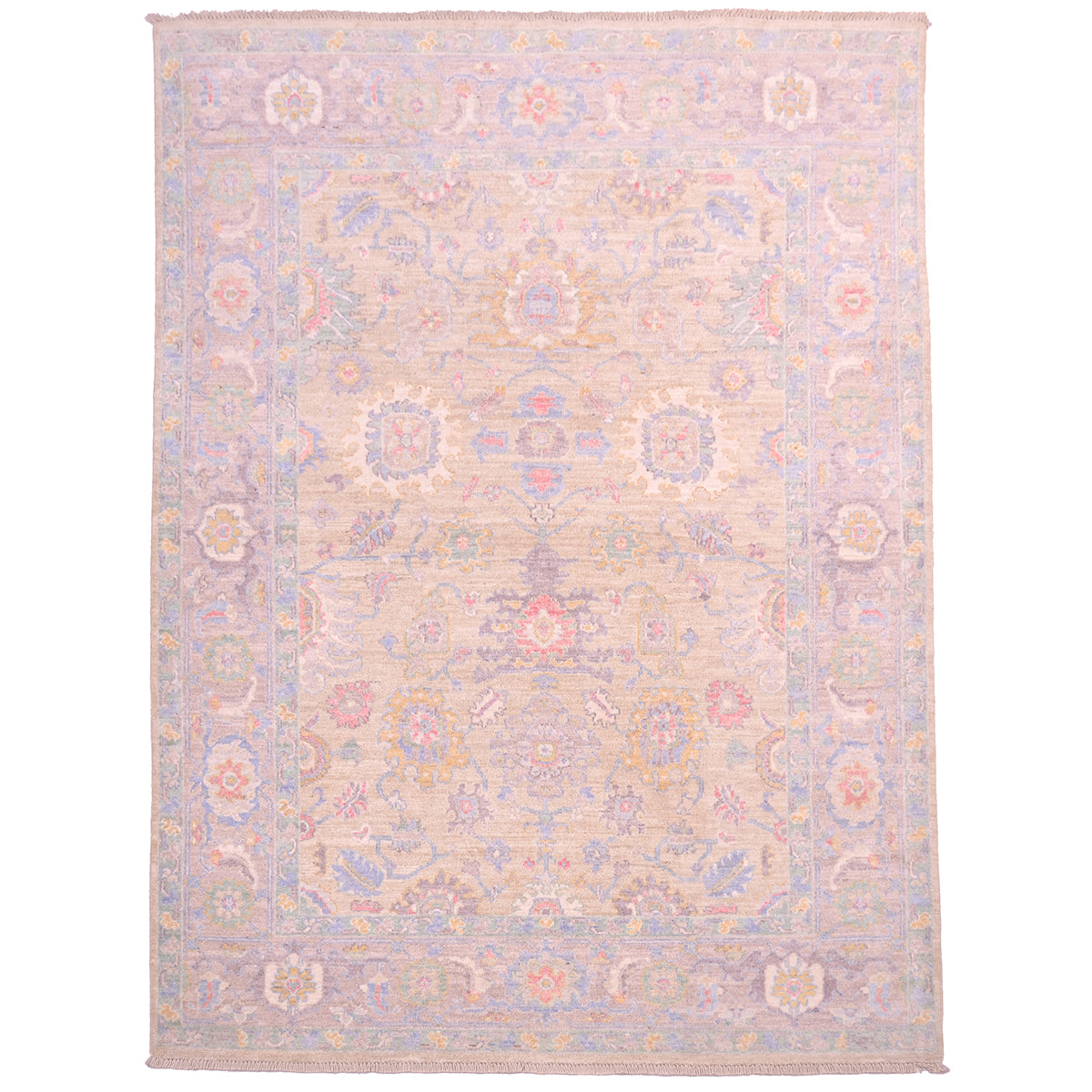 Pale Serapi rug with soft colours including a very light gold ground with all over floral design. Cloudband border with stylized leaves.