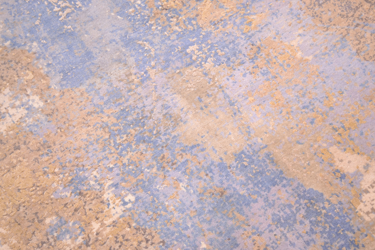 Sense of depth created with close up of pure wool and silk pile of Indain carpet with blues, greys and creams with chisled areas of pure handspun silk. Fragmented abstract expressionistic.