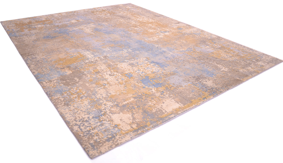 Finely knotted Indian carpet with high -low pile textured with pure wool pile with areas of handcut silk in golden and cream tones. Abstract modern design with sky cloud natural colours.