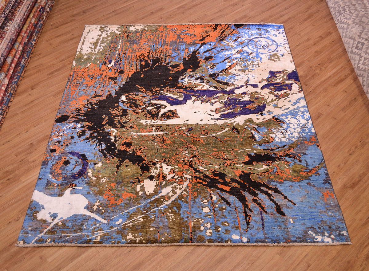 Splash carpet shows an abstract design in colours of blue, black, brown, orange and white.