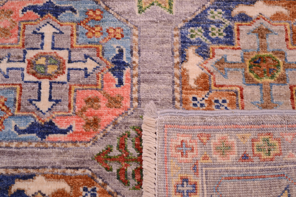 Detail showing knotting of handmade pile of Sultani rug with modern clours as well as the back of rug showing the fine knotting and cotton warp threads of the fringe.