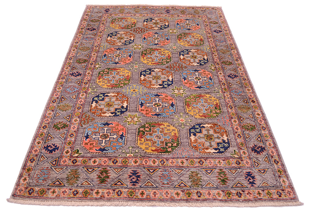 Geometric design of sultani rugs with colourful guls and als secondary devices with an all over soft grey field, Traditional design but reinterpreted colours.