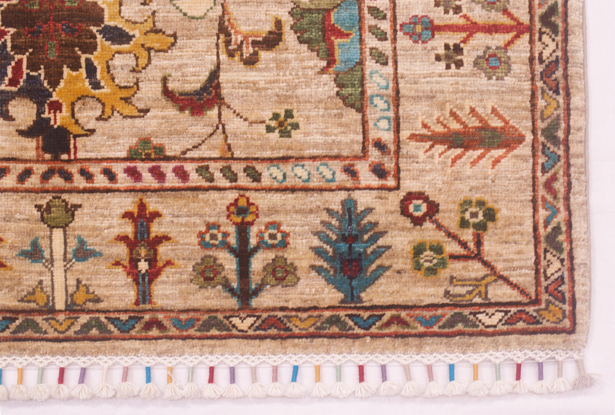 Corner of handmade rugs with colourful detailing of floral motifs spaciously presented in border and multiple leaves and palmettes in the main field. Warp threads latticed and bound with colourful coordinating yarns.