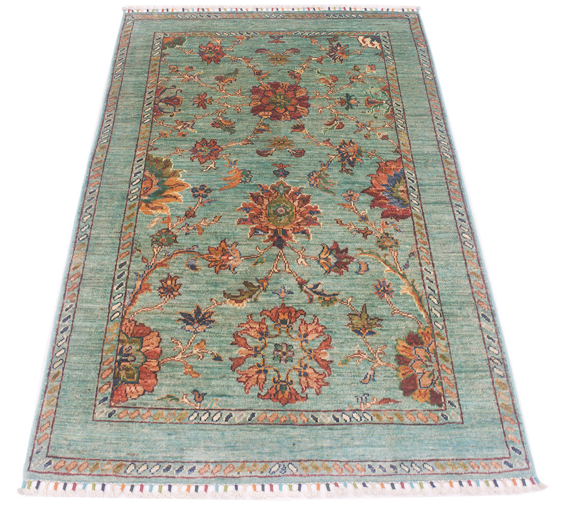 Over all view of floral field of Afghan Sultani rug with undecorated main border with simple geometric minor borders. Colours of amber, rust and greens in floral filled field decoration.