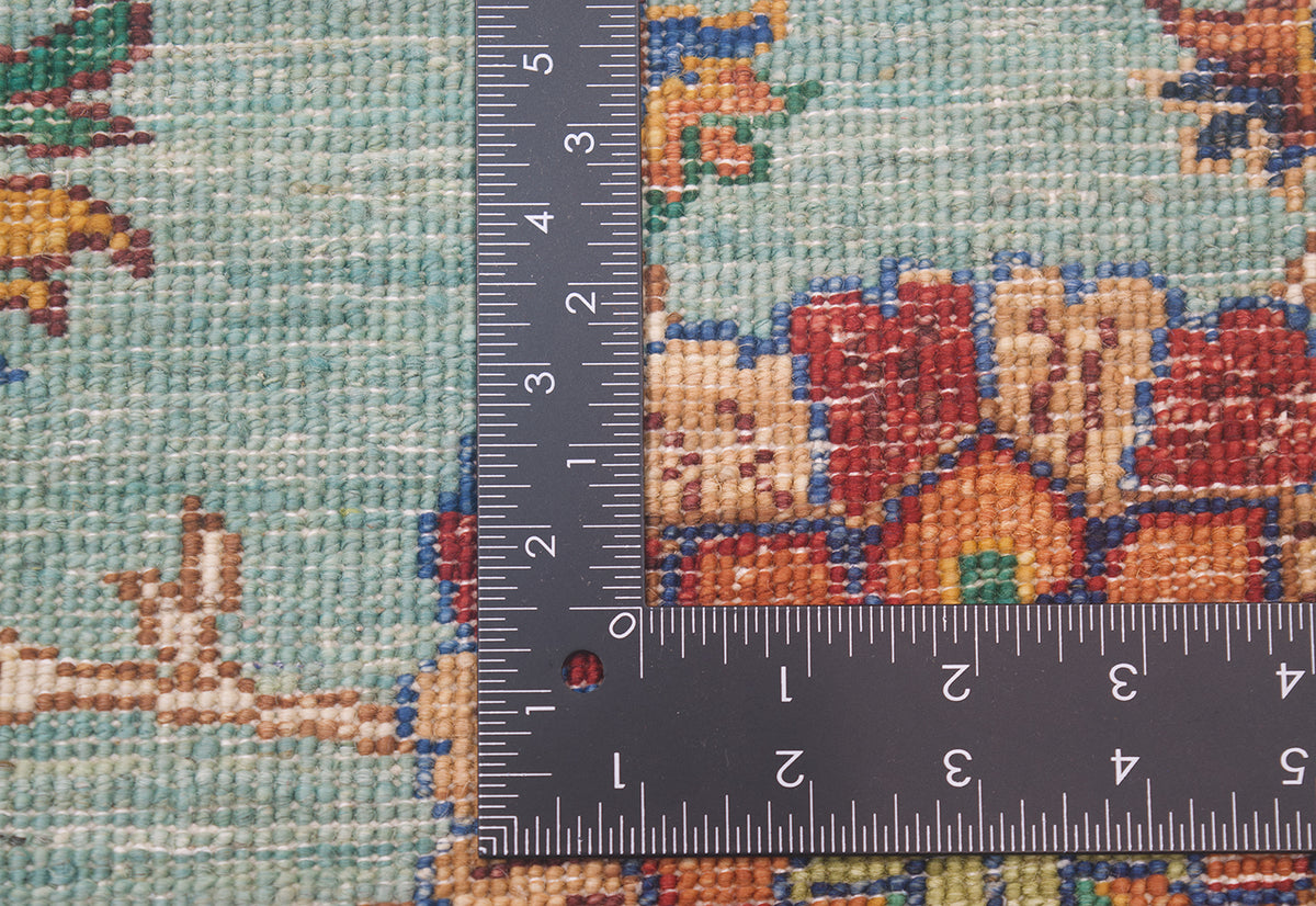 Reverse of rug showing fine knotting and and back of knots of colourful afghan handmade rug.