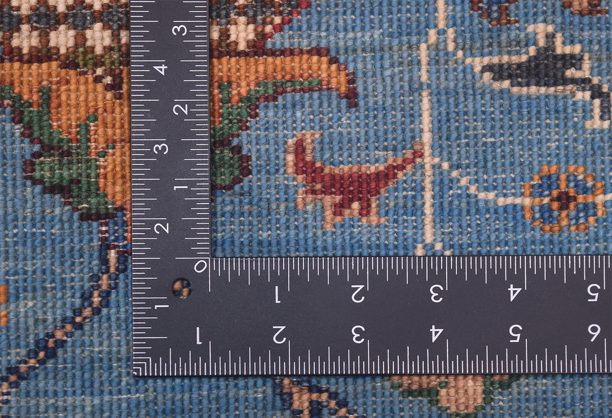 Detail of back of rug showing knotting of blue handmade sultani rug with natural vegetable dyes.