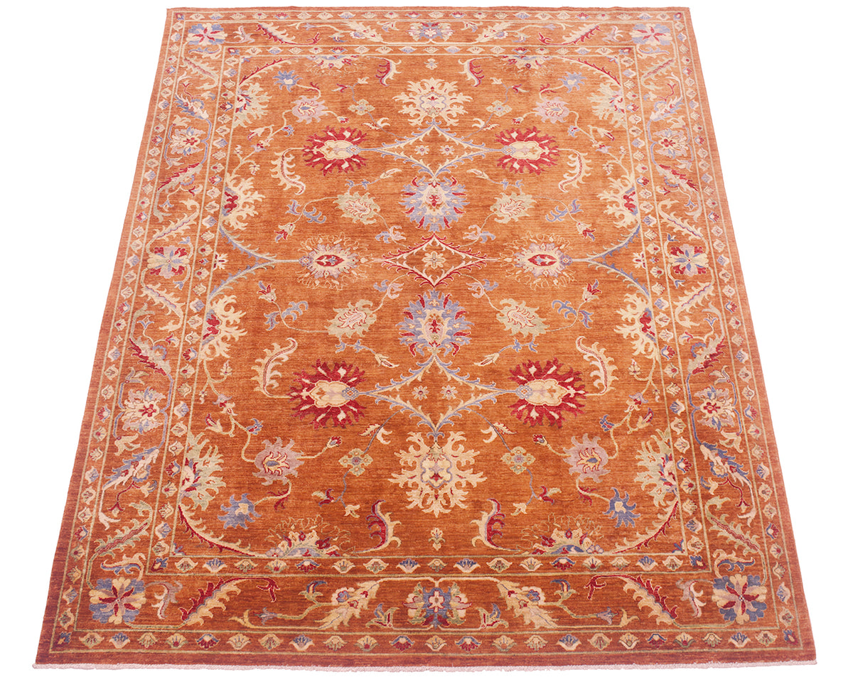All over view of Sultani carpet with traditional floral design and cinnamon-amber toned pure wool pile ground colour with multiple floral leaves and decorative palmettes in field and border.
