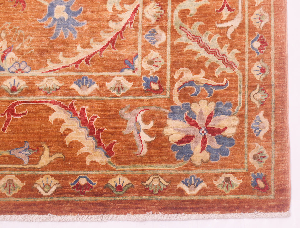 Corner design of Afghan Sultani carpet with botanical designs and warm amber ground colour offseting the red and blue accents.