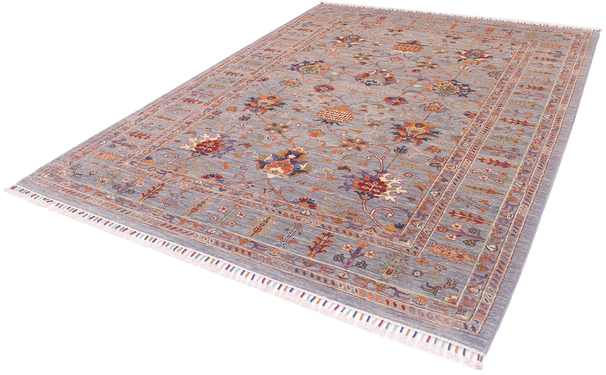 Angel view of handowven Sultaon carpet with cotton warp fringes bound with multiple colours. Grey field with hints of blue and variety of subtle colours.