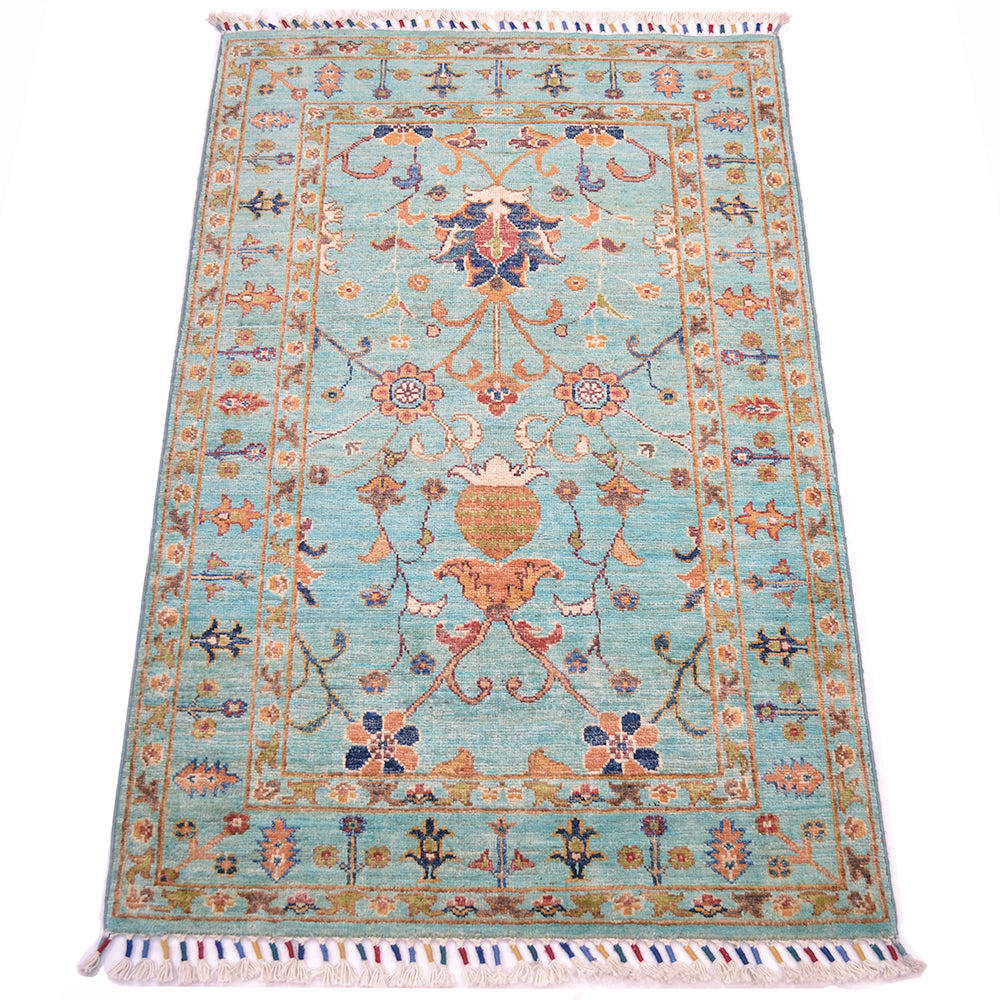 All over flroal compositions of handknotted Afghan Sutani rug with vibrant topaz coloured main field colour with a floral network of interconnecting motifs.
