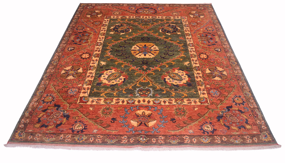 An Afghan Suzani design handmade carpet with a complex floral and medallion pattern, featuring a rust red outer border, a dark green central field, and beige and blue accents.