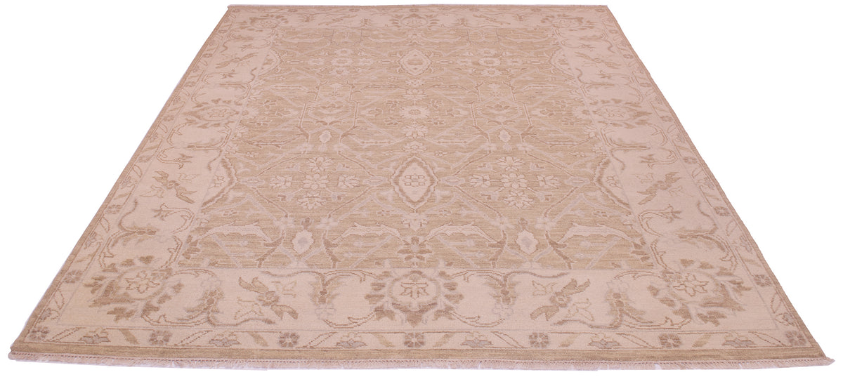 A tonal area rug with a traditional floral pattern in shades of beige and light brown, shown from a top-down perspective on a white background.