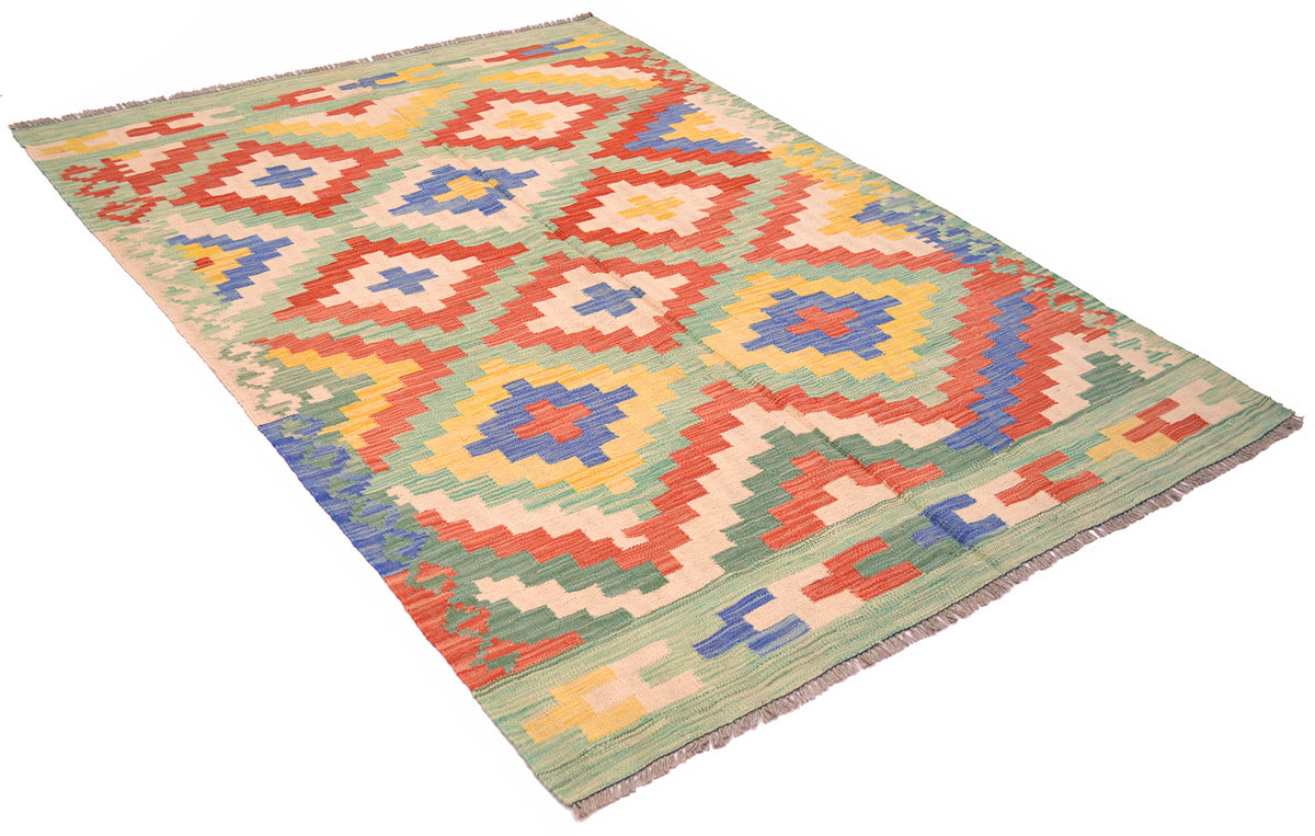 Handwoven kilim rug laid diagonally, multicolor geometric pattern with short fringe