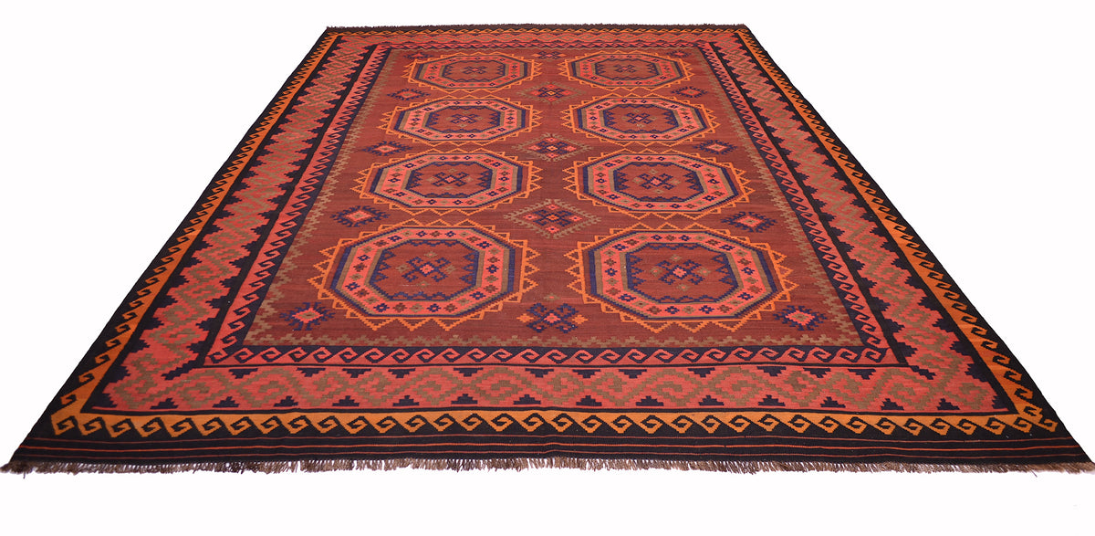A rectangular woven old Afghan Kilim with a geometric tribal pattern in rust red, orange, brown, and black, featuring a fringed edge on a white background.