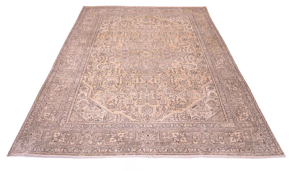 ALl over view of vintage Orietnal handmade carpet with gorudn colour of gold beigh with border base colour of light brown with hints of sage green. Floral geometric pattern outlined in chestnut brown.