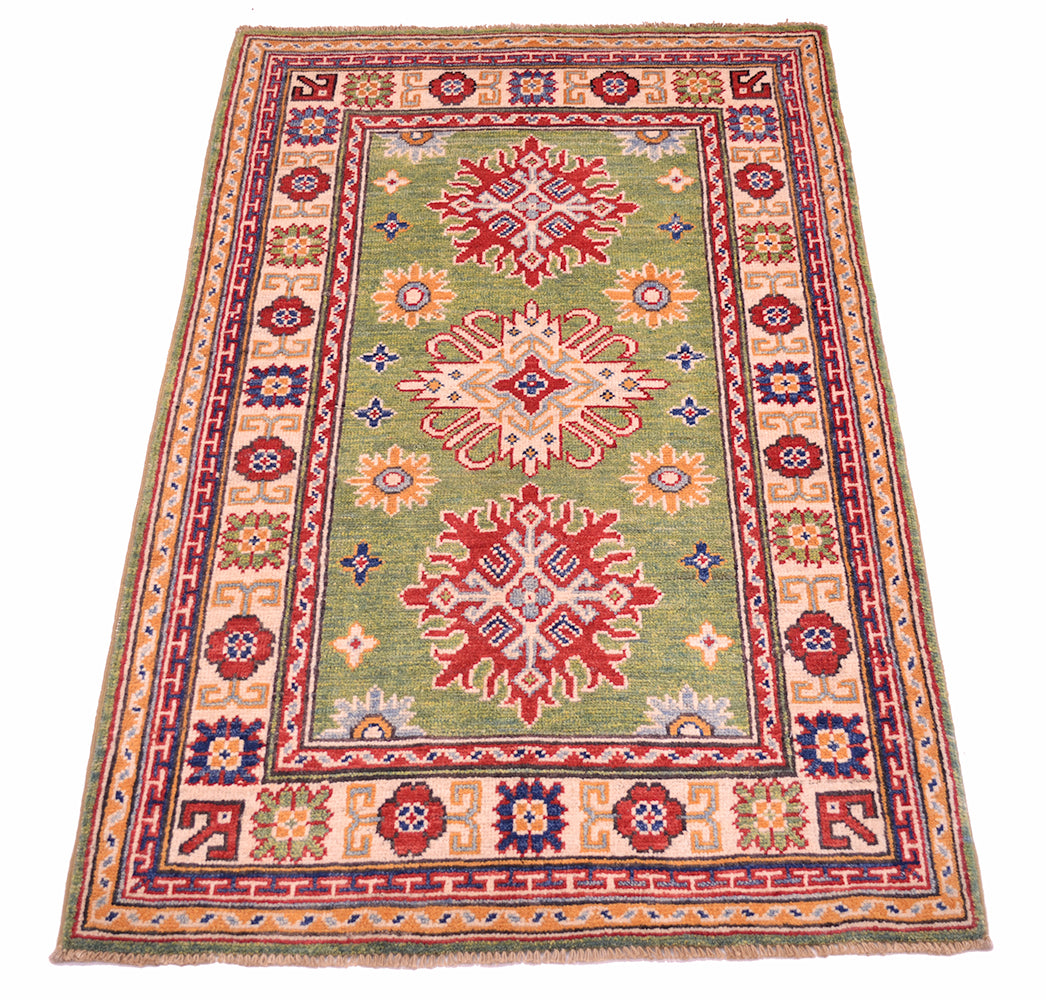 Handmade green wool Afghan Kazak rug with three red snowflake motifs and patterned border