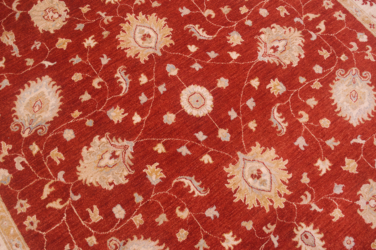 Detail of field of rust red ziegler with delicate tendrils and furling palmettes