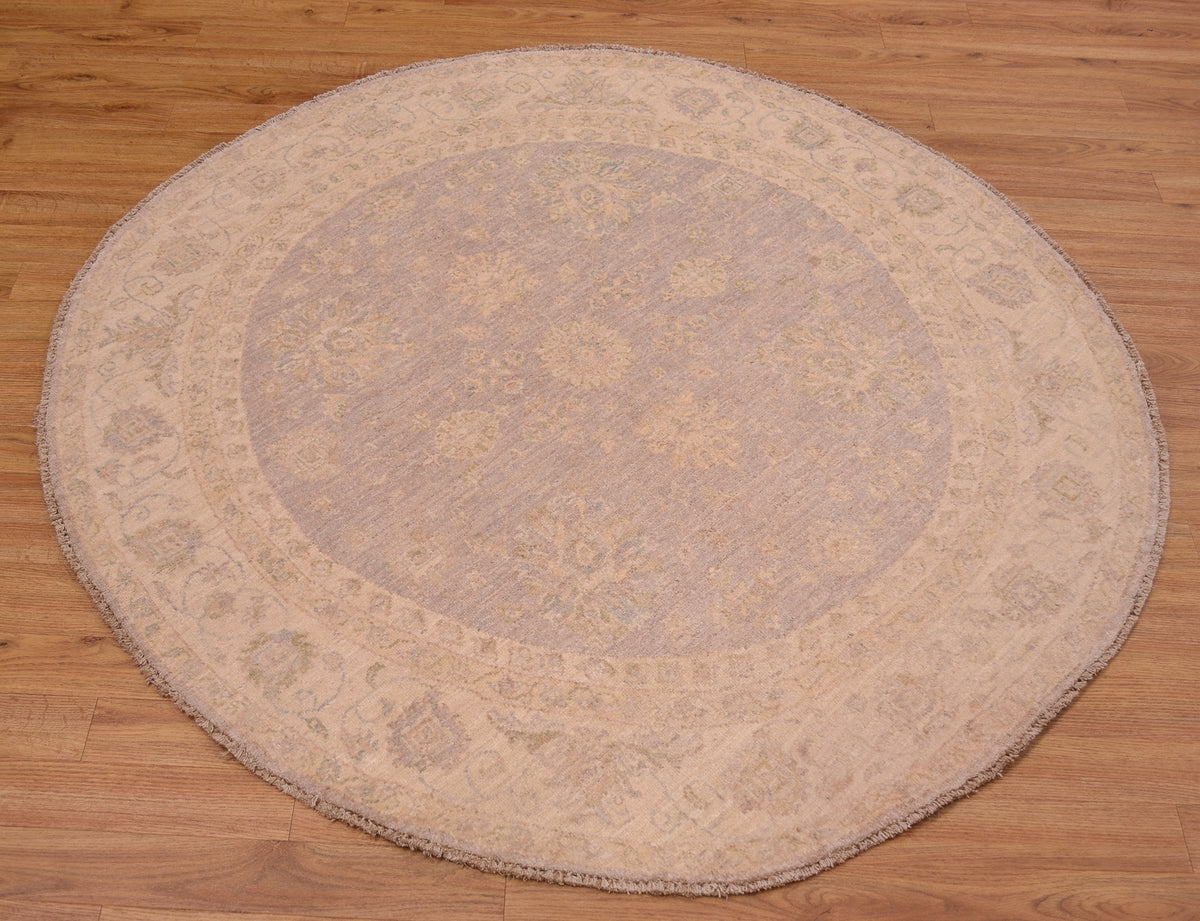 Beautiful handmade Afghan Ziegler Circle Rug with soft colours of grey with beige in a hard-to-find circular rug size.