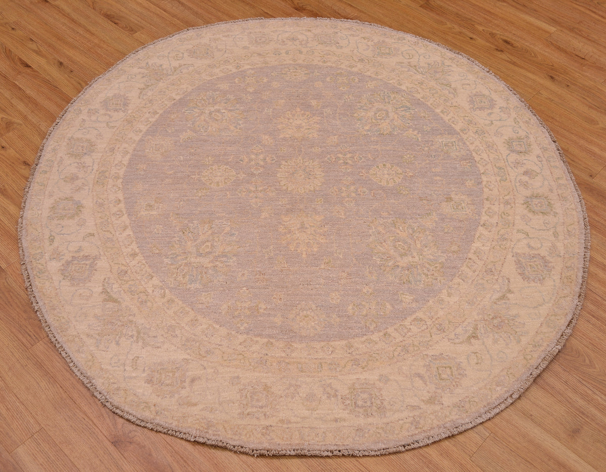 Beautiful handmade Afghan Ziegler Circle Rug with soft colours of grey with beige in a hard-to-find circular rug size.