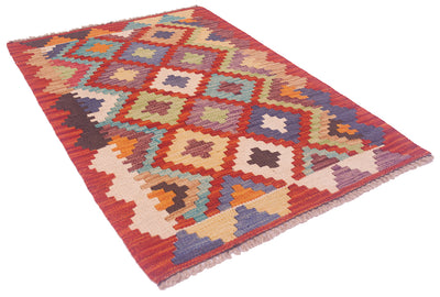 Handwoven kilim rug with multicolor geometric pattern in red, cream and blue tones