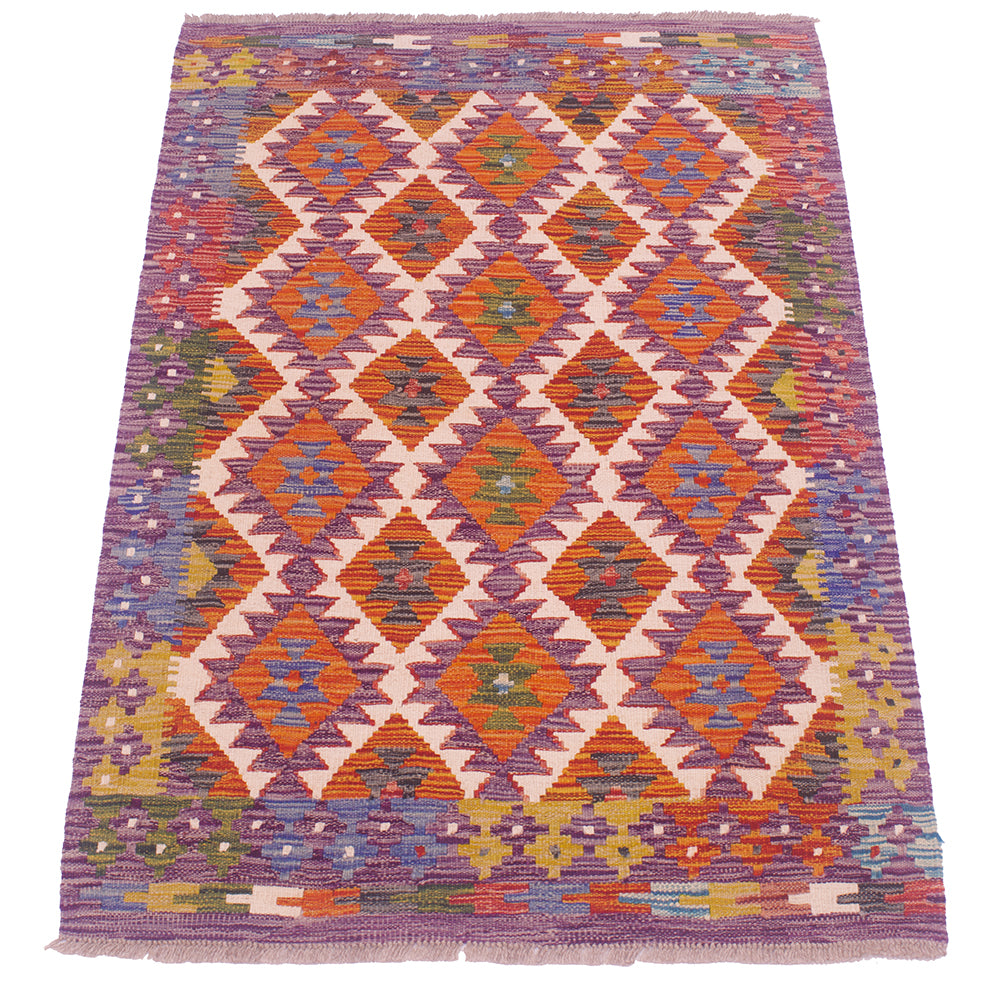 Kilim rug in purple and orange with repeating diamond and cross patterns, flat woven.
