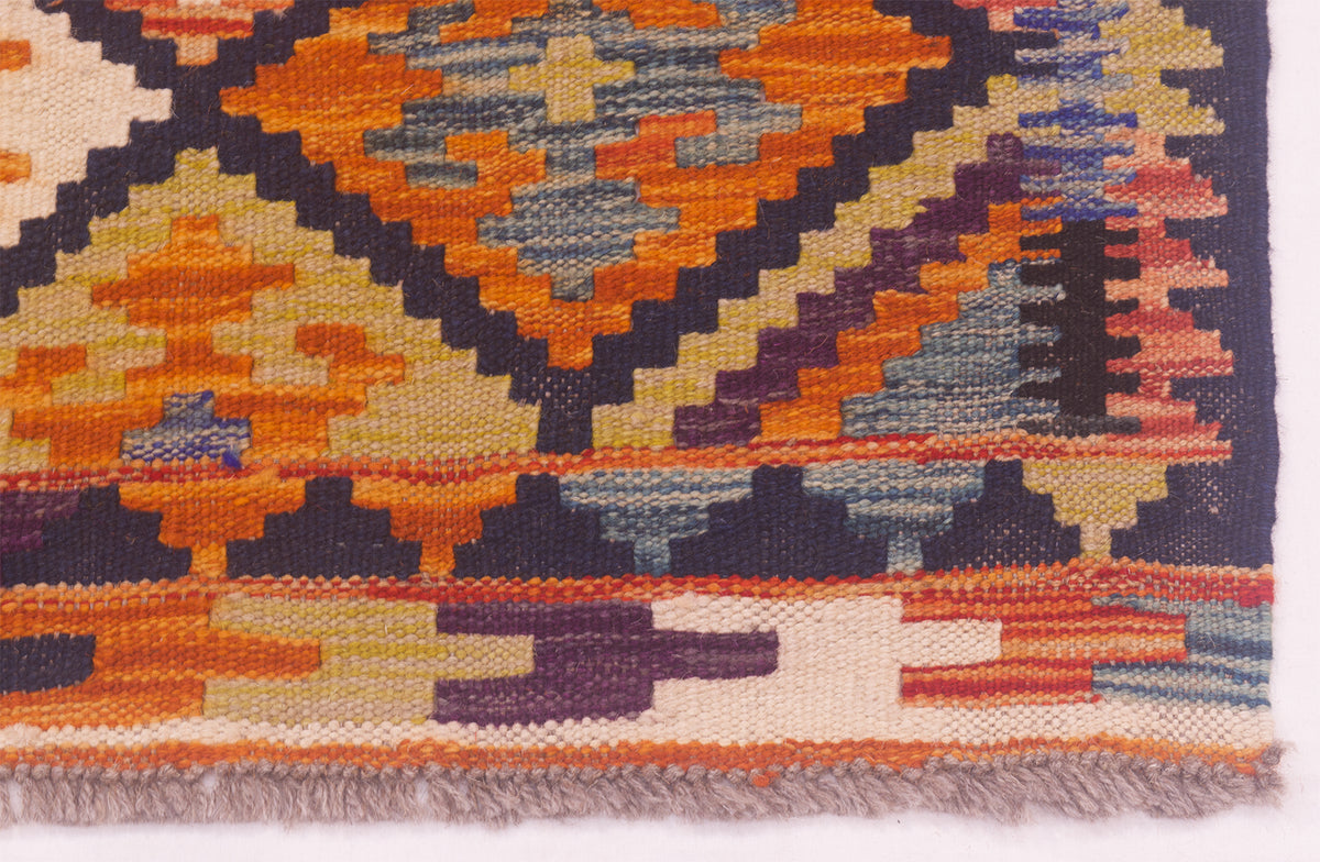 Corner of Afghan kilim showing the woollen fringes 