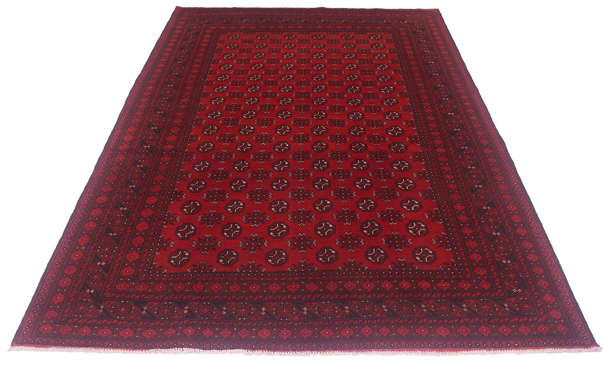 A rectangular red oriental Afghan rug with a black border and intricate geometric patterns, shown flat against a white background.