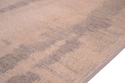Detailed view of pure wool pile of  Indian handknotted carpet with soft grey hazy blurred borderless design.  Minimalist style.