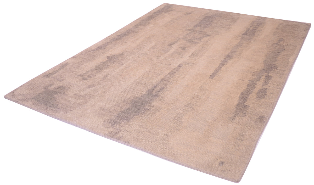 Angel view of abstract modern carpet with restrained palette of beige, greys and ivory creams with softened design.