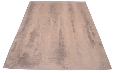 Overall view of abstract modern carept woven in Indian with wool pile woven on cotton foundation. Nuanced, softened neutral pastel tones in grey and beiges.
