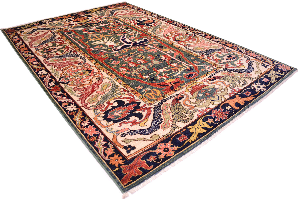 Angled view of impressive Garous Bidjar design carpet handwoven in afghanisitan with large main border in cream and dark blue with main field ciolour of teal green.