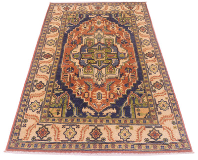 A traditional oriental Afghan Heriz area rug with a complex geometric pattern in beige, rust orange, navy blue, olive green, and red, shown flat against a white background.
