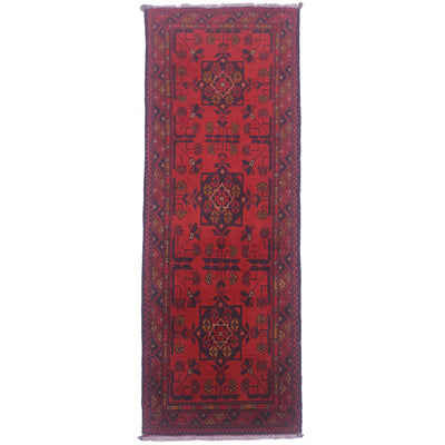 Red patterned rug runner with geometric medallion border