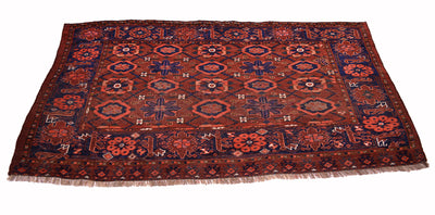A traditional antique Turkoman Ersari Beshir style Chuval or rug with a complex geometric and floral pattern in dark red, navy blue, and rust orange, featuring a fringed edge on a white background.