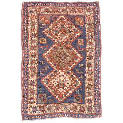 Blue colour antique Kazak rug with geometric triple medallion design.