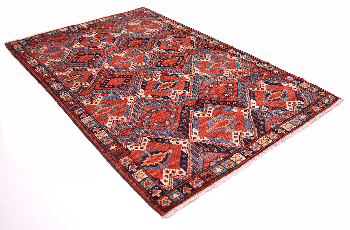 A rectangular traditional hand-knotted fine antique style Beshir rug with a geometric pattern in rust-red, blue, beige, and black, photographed on a white background.