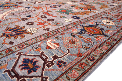 Detail of finely woven border of Afghan Aryana with antique Serapi design with cloudband border. Blue background with rosette and vine minor borders.  Handknotted with natural vegetable dyes.