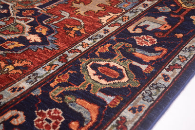 Close-up of rug corner with multicolor geometric pattern and navy border