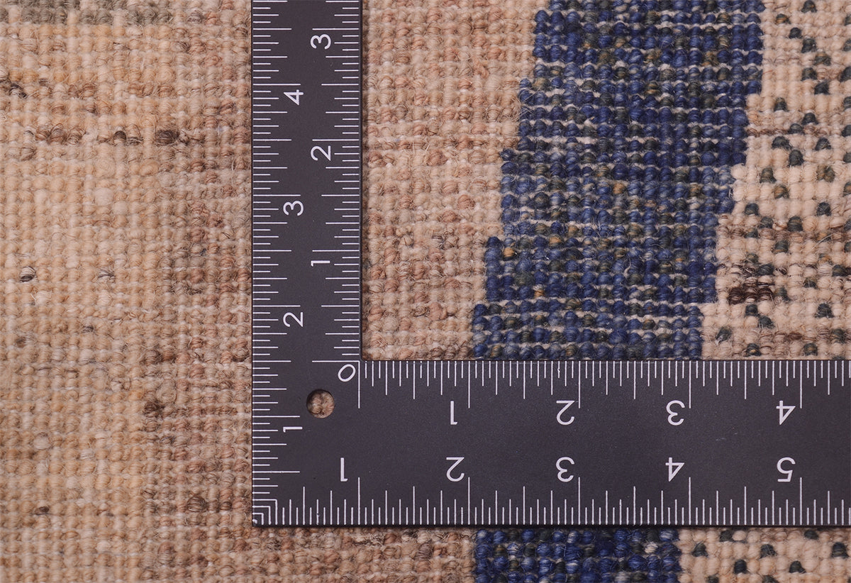 Back of abstract handmade rug showing fine knotting of pure wool pile and cotton warps.