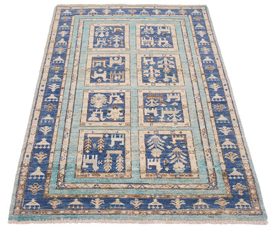 A rectangular Afghan small rug with a traditional geometric and tribal pattern, featuring a dominant blue field, light blue borders, and beige motifs depicting stylised animals and trees.