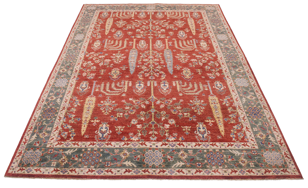 A rectangular traditional Afghan fine Aryana pictorial area rug with a red central field, detailed floral motifs, and a patterned border in muted green, beige, and red tones, shown flat against a white background.