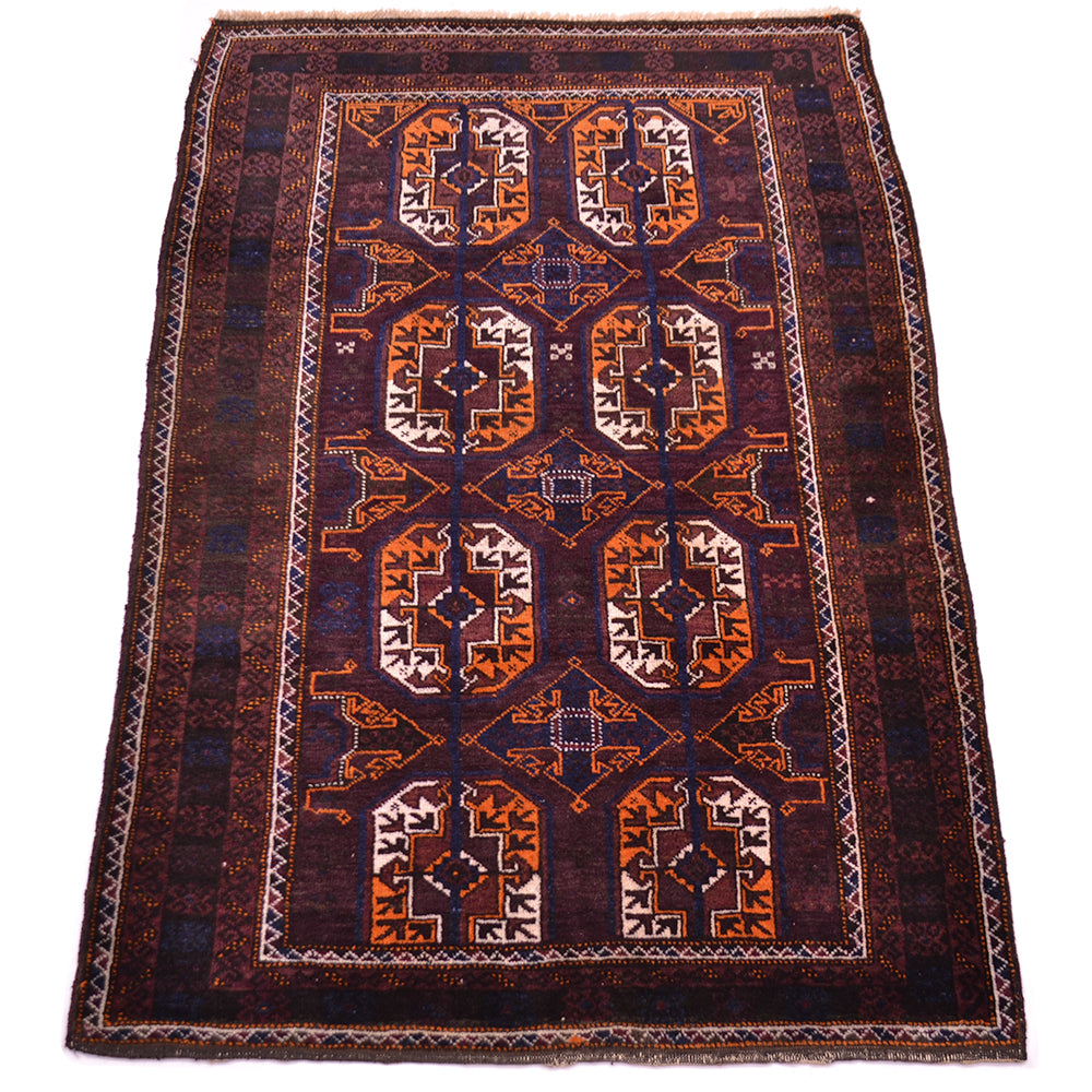 A traditional rectangular Afghan-style Old Baluchi rug with a dark brown and black field, featuring a central vertical panel with repeating orange, beige, and brown geometric gul motifs and a patterned border.
