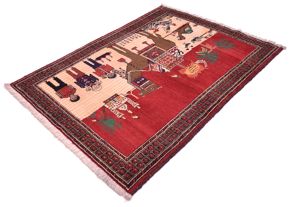 A rectangular hand-woven Pictorial Belouch rug with a deep red field, cream-coloured border, and detailed multicolour motifs including figures, animals, and geometric patterns, finished with a fringed edge.