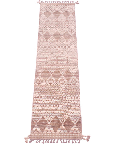 A long rectangular woven runner rug with a geometric diamond pattern in brown and beige, featuring tassels on both ends, shown against a plain white background.