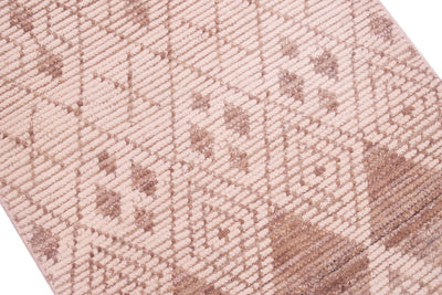 A close-up of a woven textile with a geometric diamond pattern in beige and taupe brown.